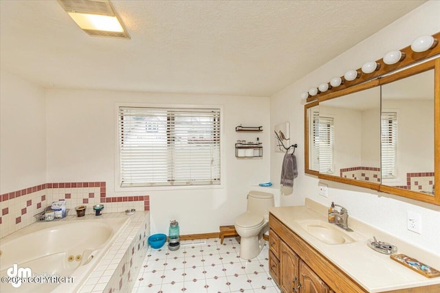 10209 Colville St, Eagle River, AK 99577 - full bath featuring vanity, toilet, tile patterned floors, a textured ceiling, and a tub with jets