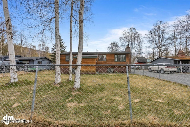 10209 Colville St, Eagle River, AK 99577 - view of front of property featuring fence and a front lawn