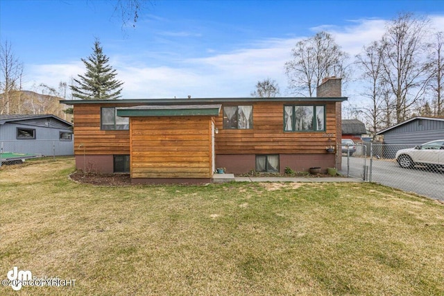 10209 Colville St, Eagle River, AK 99577 - view of front of property with fence, a chimney, and a front lawn