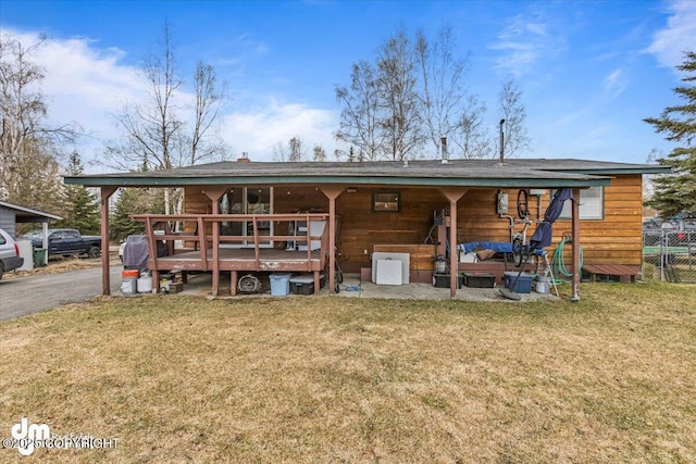 10209 Colville St, Eagle River, AK 99577 - rear view of house with a lawn and fence