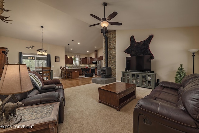 3604 N Copperspike St, Wasilla, AK 99623 - living room featuring ceiling fan, a wood stove, high vaulted ceiling, and recessed lighting