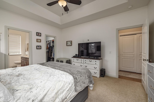 3604 N Copperspike St, Wasilla, AK 99623 - bedroom featuring light colored carpet, a spacious closet, a closet, ensuite bath, and baseboards
