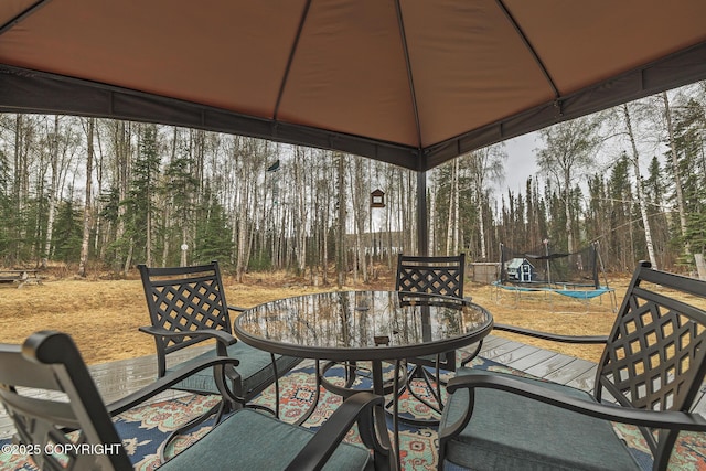 3604 N Copperspike St, Wasilla, AK 99623 - view of patio / terrace with a trampoline and outdoor dining space