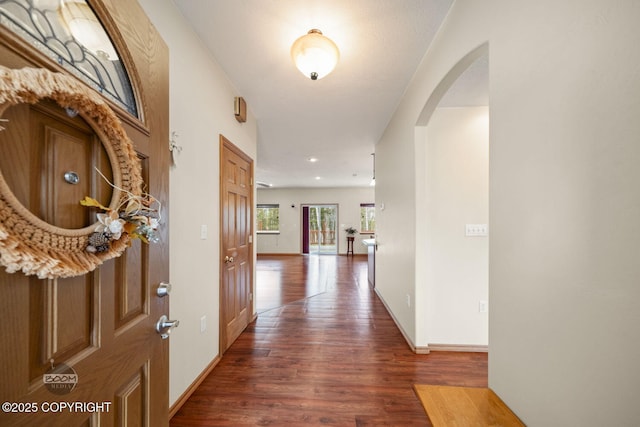 3600 N Fortune Cir, Wasilla, AK 99654 - entryway with dark wood-style floors, arched walkways, and baseboards