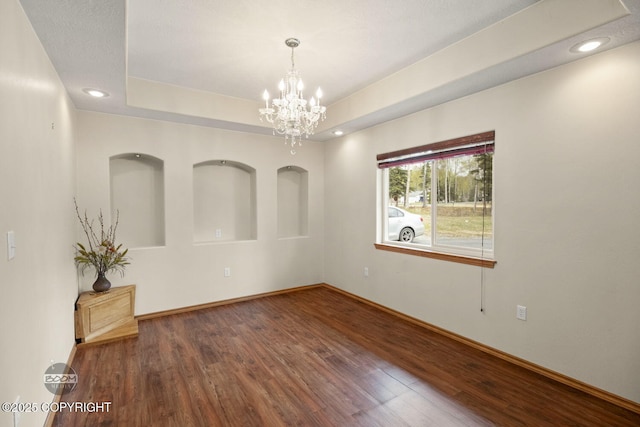 3600 N Fortune Cir, Wasilla, AK 99654 - spare room with wood finished floors, a chandelier, baseboards, a raised ceiling, and recessed lighting