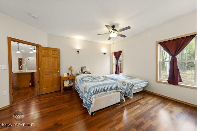 3600 N Fortune Cir, Wasilla, AK 99654 - bedroom with dark wood-style flooring, a sink, baseboards, and ceiling fan