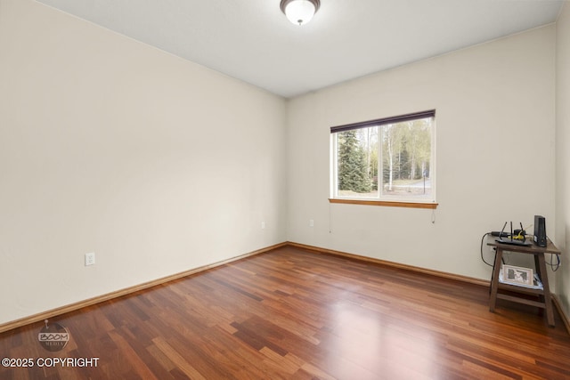 3600 N Fortune Cir, Wasilla, AK 99654 - unfurnished room featuring wood finished floors and baseboards