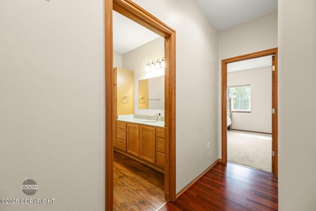 3600 N Fortune Cir, Wasilla, AK 99654 - hallway with a sink, dark wood finished floors, and baseboards