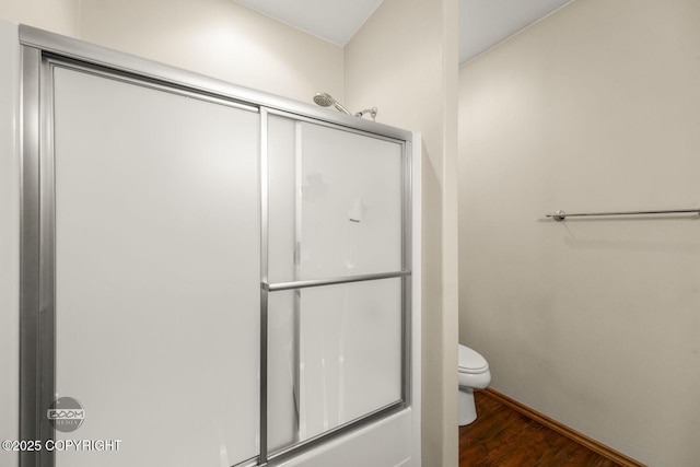 3600 N Fortune Cir, Wasilla, AK 99654 - bathroom featuring an enclosed shower, toilet, and wood finished floors