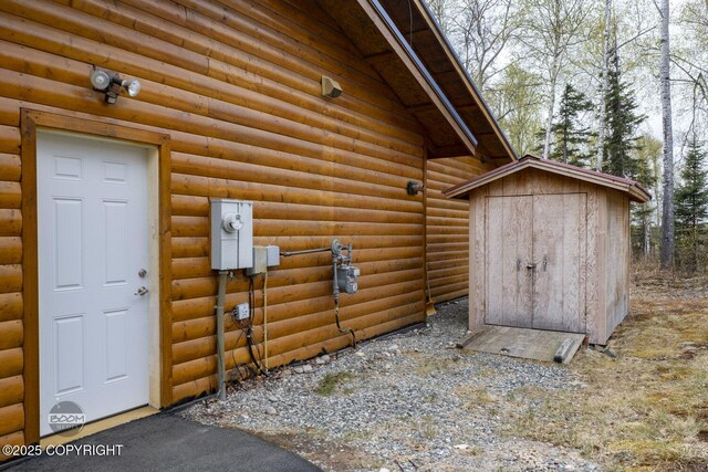 3600 N Fortune Cir, Wasilla, AK 99654 - view of exterior entry featuring faux log siding