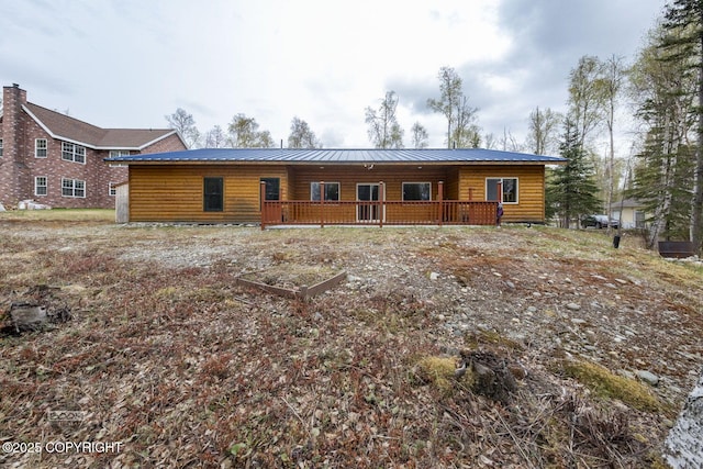 3600 N Fortune Cir, Wasilla, AK 99654 - rear view of property featuring metal roof, covered porch, and log veneer siding