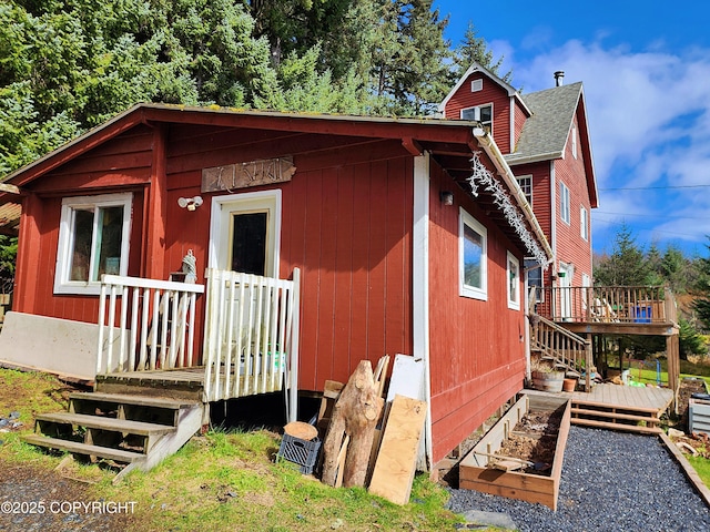 view of outbuilding featuring stairs