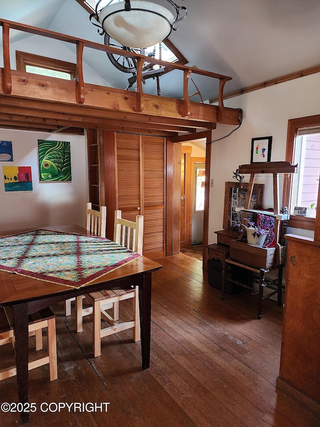 dining space featuring crown molding and wood-type flooring