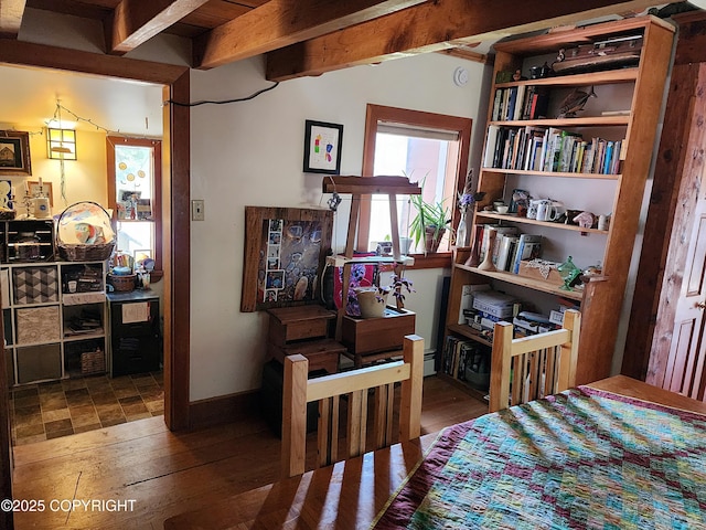 interior space featuring beamed ceiling and wood-type flooring