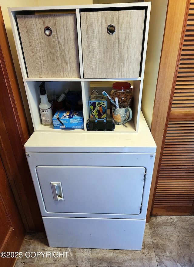 washroom featuring laundry area and washer / dryer
