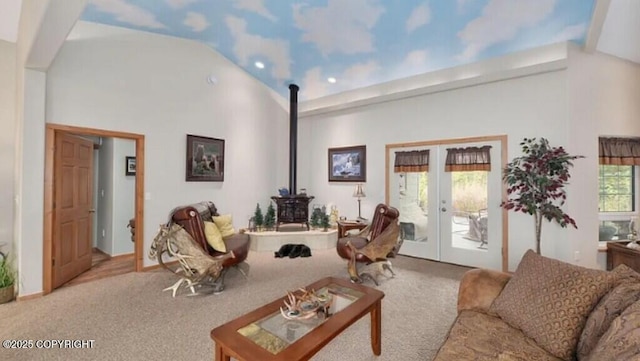 21899 Sterling Hwy, Cooper Landing, AK 99572 - carpeted living area featuring a wood stove, recessed lighting, vaulted ceiling, and french doors