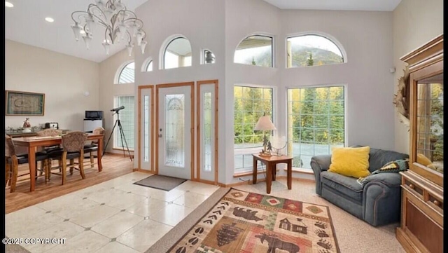 21899 Sterling Hwy, Cooper Landing, AK 99572 - foyer entrance with recessed lighting, a high ceiling, and an inviting chandelier