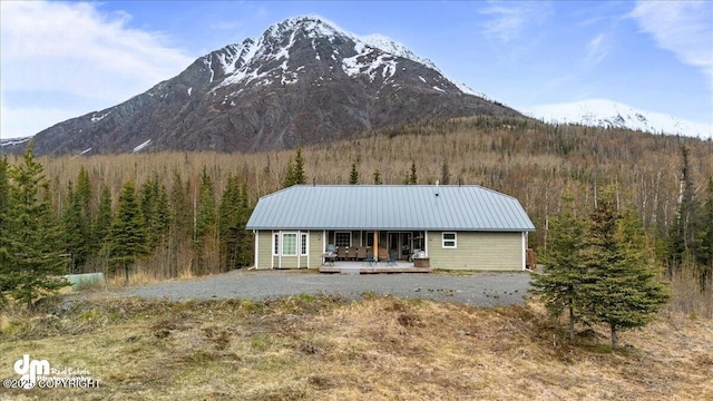 21899 Sterling Hwy, Cooper Landing, AK 99572 - back of property with a mountain view, metal roof, and a forest view