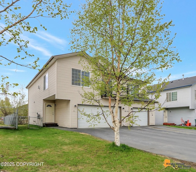 view of front of house with an attached garage and driveway
