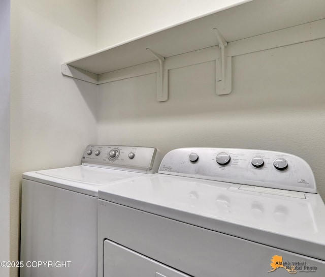 laundry area featuring washing machine and clothes dryer