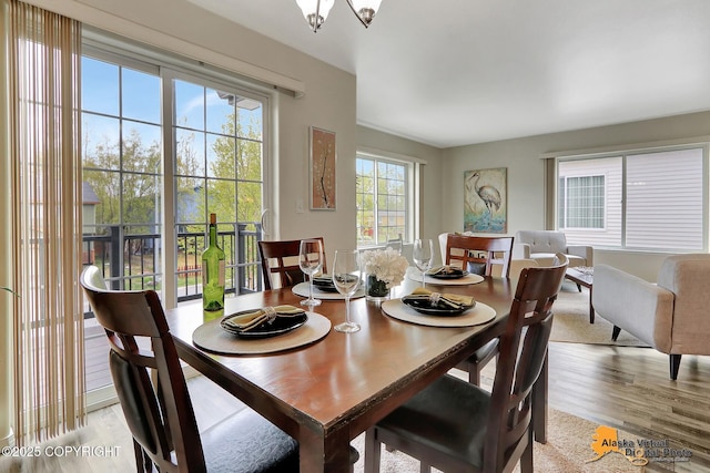 dining space with light wood finished floors