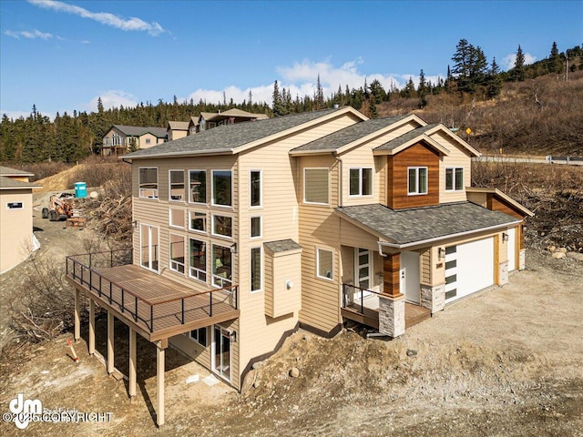 6485 Prominence Pointe Dr, Anchorage, AK 99516 - rear view of house with roof with shingles, a garage, and driveway