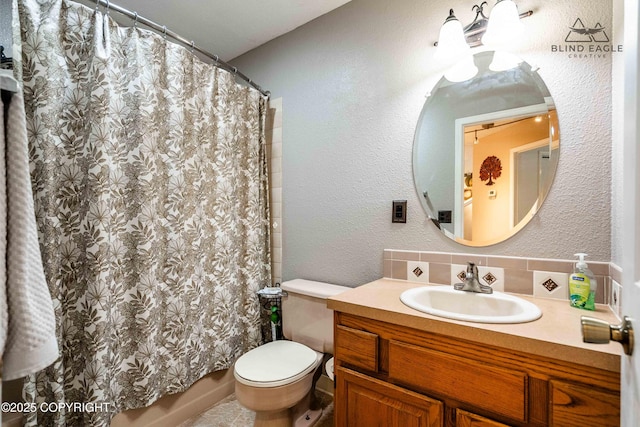 2000 Wenmatt Cir, Anchorage, AK 99517 - full bath featuring vanity, a shower with shower curtain, and tasteful backsplash