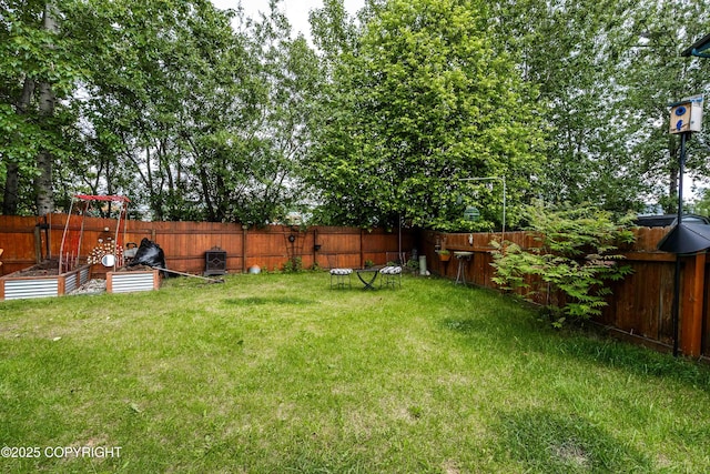 2000 Wenmatt Cir, Anchorage, AK 99517 - fenced backyard with a vegetable garden