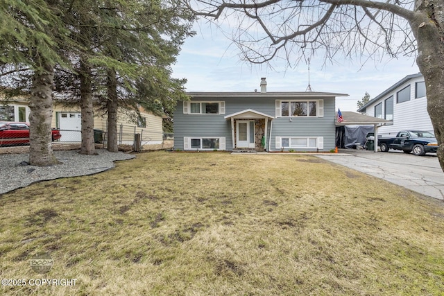1851 E 53rd Ave, Anchorage, AK 99507 - bi-level home with fence, a chimney, and a front lawn