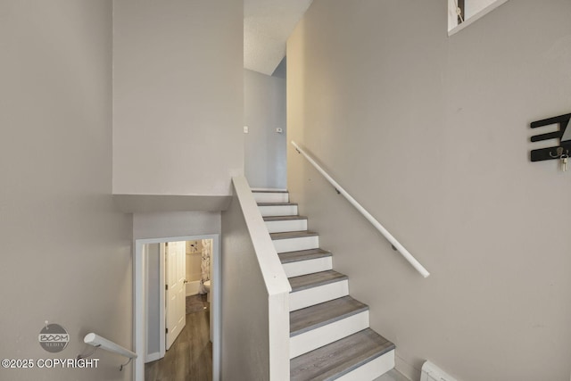 1851 E 53rd Ave, Anchorage, AK 99507 - stairway with baseboards and wood finished floors