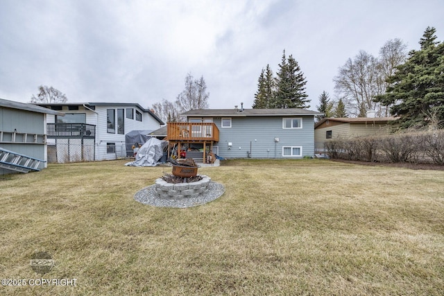 1851 E 53rd Ave, Anchorage, AK 99507 - back of house with a lawn, a fire pit, and a deck