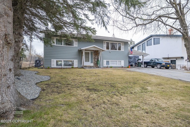 1851 E 53rd Ave, Anchorage, AK 99507 - bi-level home featuring fence, driveway, and a front yard