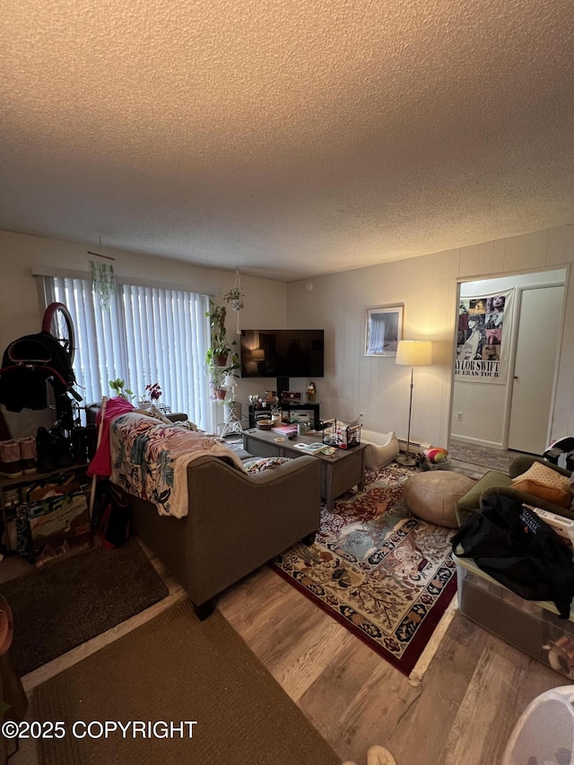 3505 Iowa St, Anchorage, AK 99517 - living room with a textured ceiling and wood finished floors