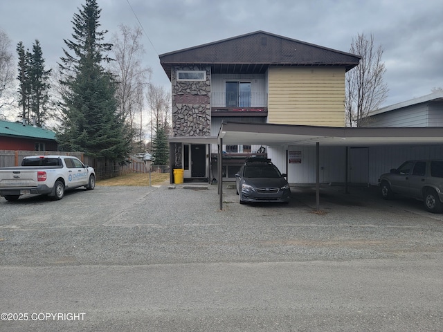 3505 Iowa St, Anchorage, AK 99517 - traditional-style house featuring driveway, fence, and a carport