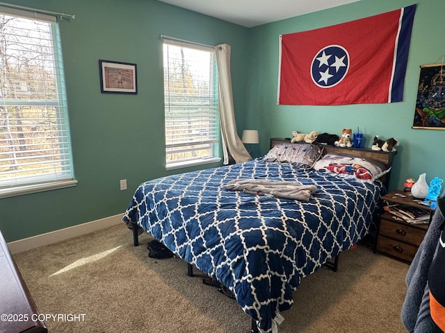 bedroom featuring carpet floors and baseboards