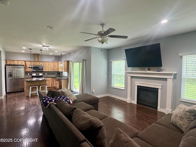 6230 N Crupperdock Dr, Palmer, AK 99645 - living area featuring a ceiling fan, a fireplace, recessed lighting, and dark wood finished floors