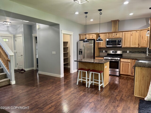 6230 N Crupperdock Dr, Palmer, AK 99645 - kitchen featuring stainless steel appliances, a kitchen island, dark wood finished floors, recessed lighting, and hanging light fixtures