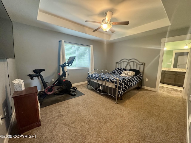 6230 N Crupperdock Dr, Palmer, AK 99645 - bedroom with a tray ceiling, carpet floors, connected bathroom, and a ceiling fan