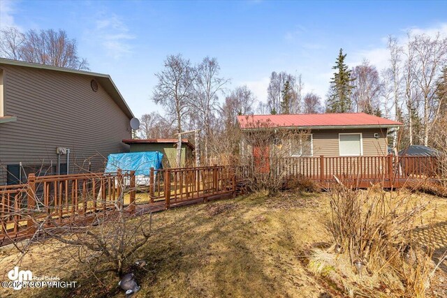 view of yard featuring a wooden deck