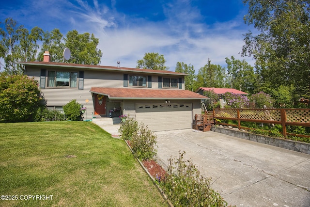 104 Beech Ave, Kenai, AK 99611 - view of front of home featuring concrete driveway, a garage, and a chimney