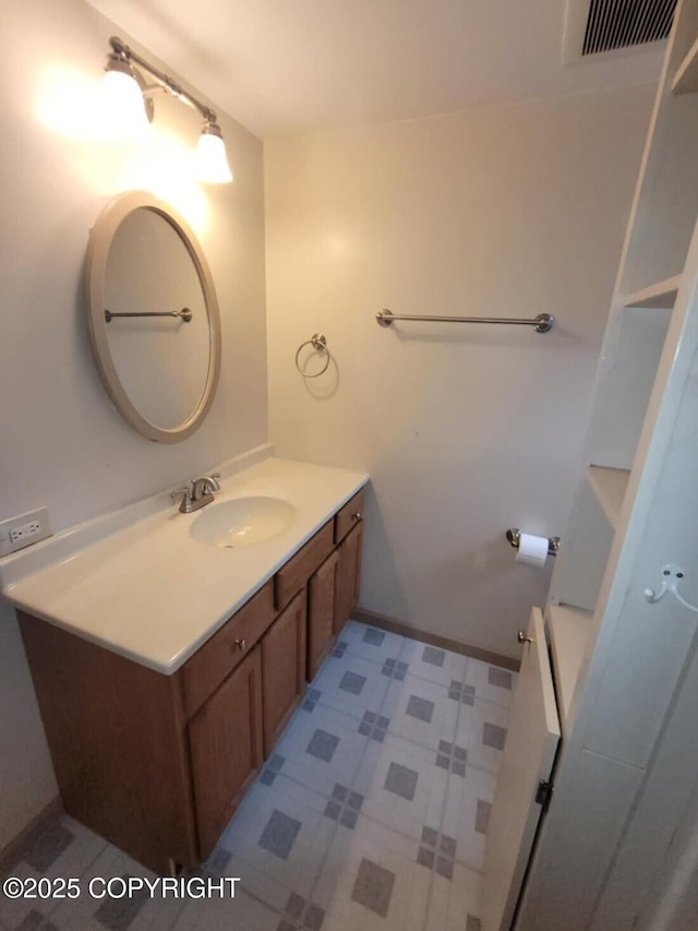 584 Small Tracts Rd, Haines, AK 99827 - bathroom with baseboards, visible vents, tile patterned floors, and vanity