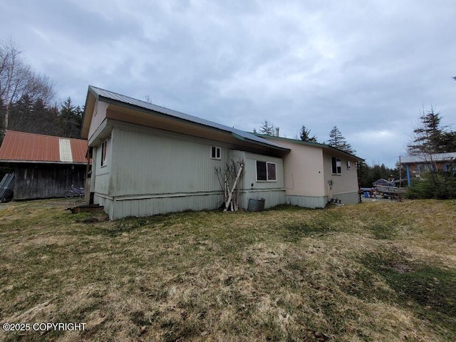 584 Small Tracts Rd, Haines, AK 99827 - back of house with a yard, central AC, and metal roof