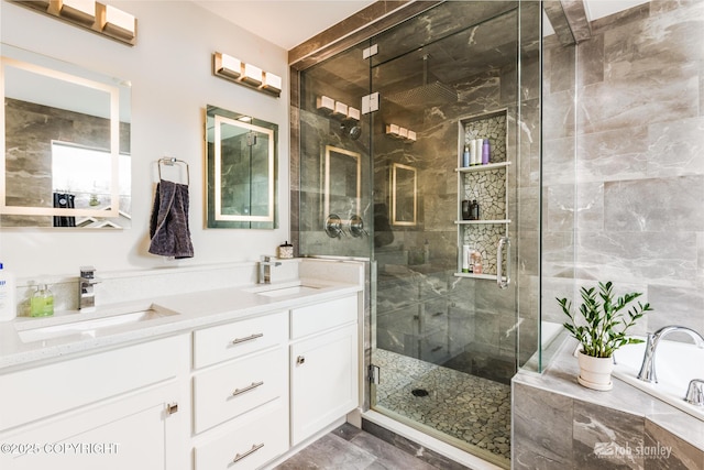 3030 E Sandman Cir, Wasilla, AK 99654 - full bathroom featuring a stall shower, double vanity, marble look tiles, and a tub to relax in