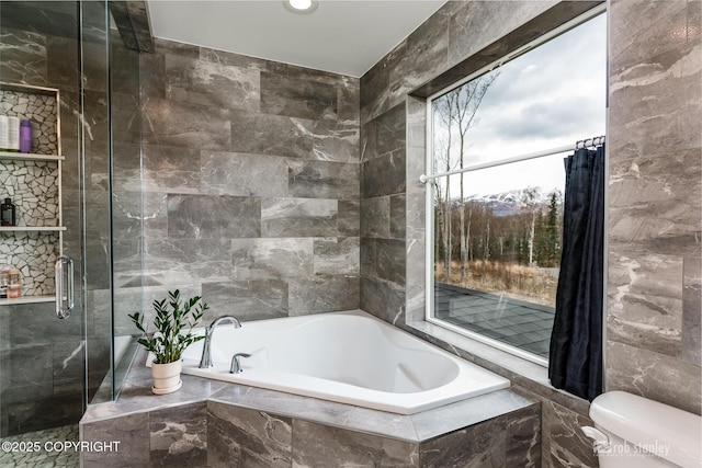 3030 E Sandman Cir, Wasilla, AK 99654 - bathroom with a garden tub, tile walls, toilet, a stall shower, and recessed lighting