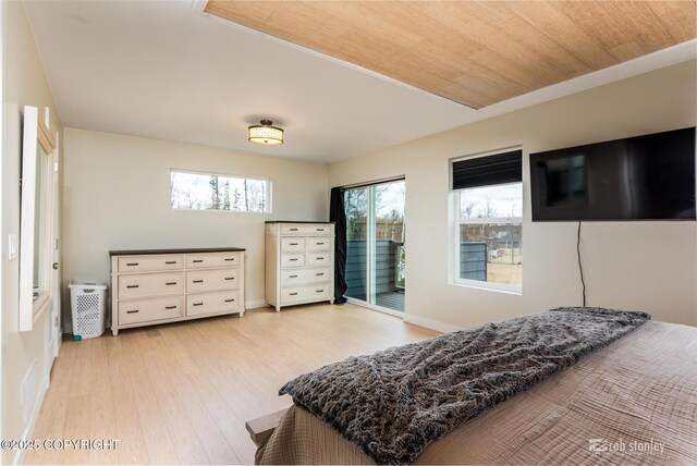 3030 E Sandman Cir, Wasilla, AK 99654 - bedroom with access to outside, light wood-style floors, and baseboards