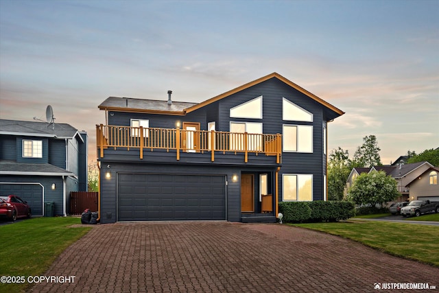 800 Howard Cir, Anchorage, AK 99504 - contemporary home featuring a balcony, driveway, a yard, and a garage