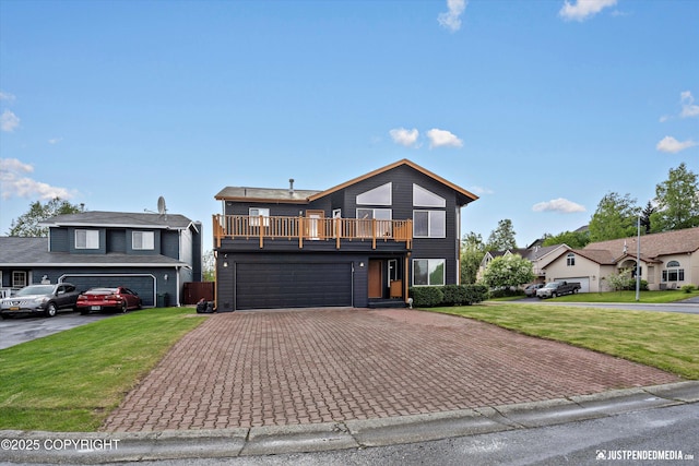 800 Howard Cir, Anchorage, AK 99504 - view of front facade featuring a balcony, a front yard, driveway, and an attached garage
