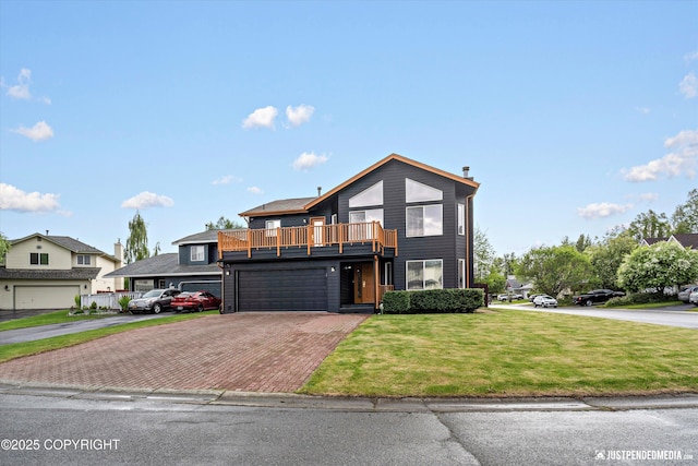800 Howard Cir, Anchorage, AK 99504 - view of front facade featuring decorative driveway, a balcony, a front yard, and an attached garage