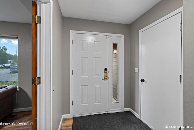 800 Howard Cir, Anchorage, AK 99504 - foyer with baseboards and dark wood finished floors