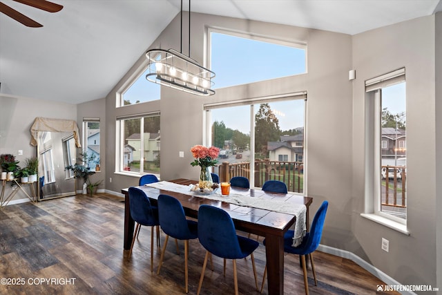 800 Howard Cir, Anchorage, AK 99504 - dining space with high vaulted ceiling, a chandelier, healthy amount of natural light, dark wood-style flooring, and baseboards